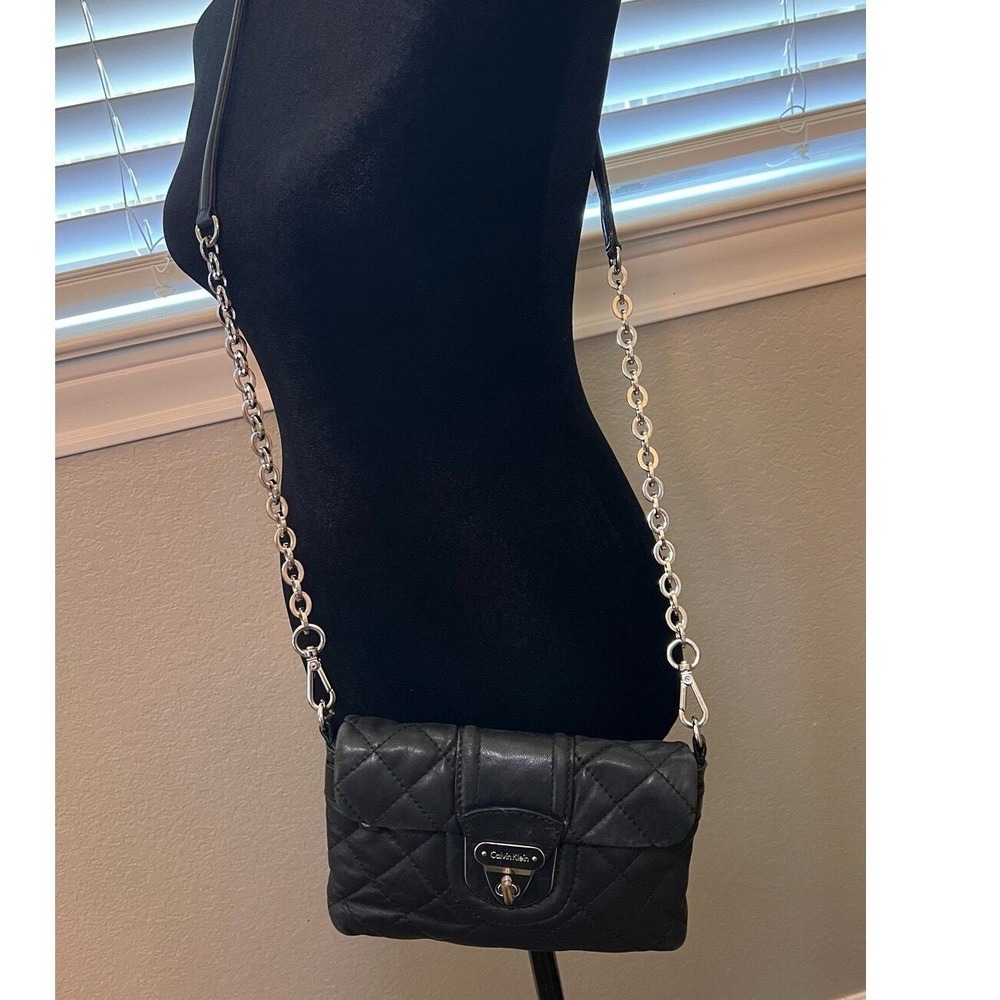 Calvin Klein quilted black leather crossbody bag w/ silver chain & zipper.